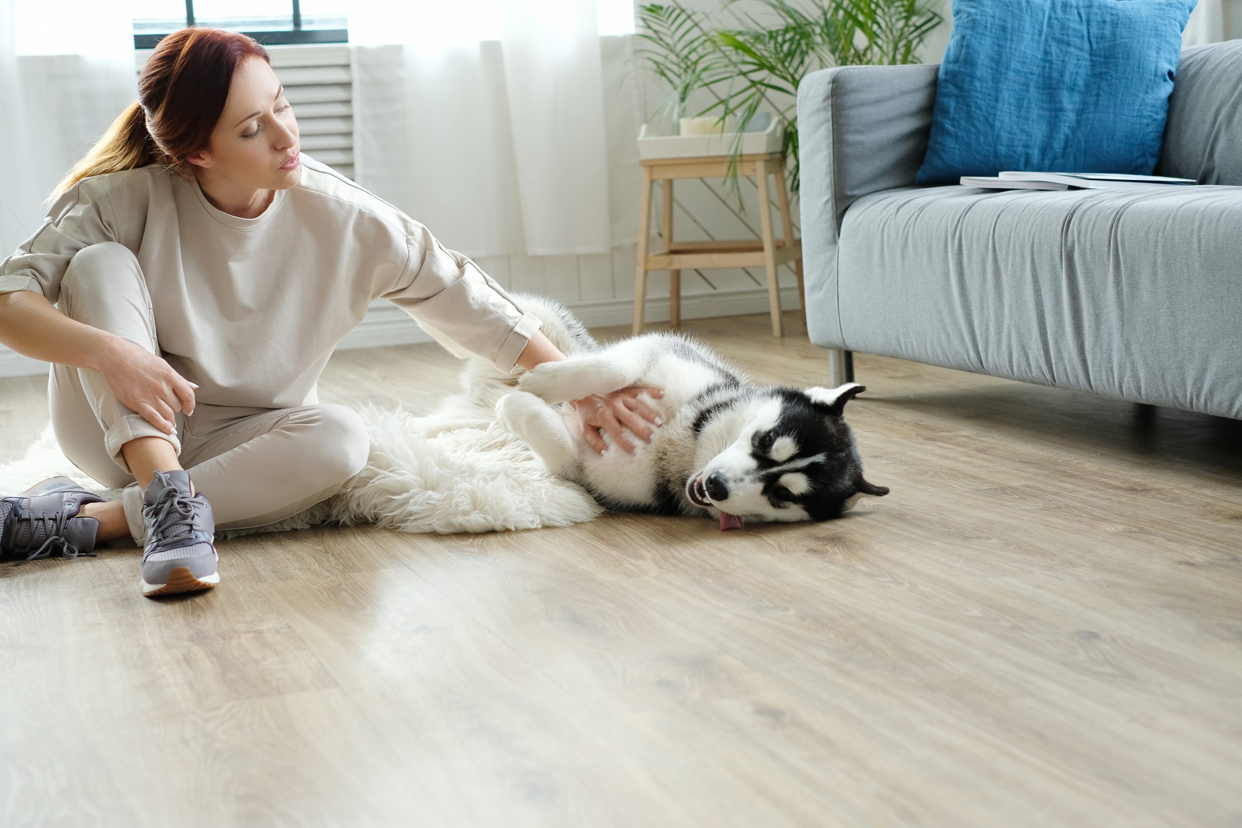 Woman with husky at home